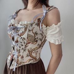 Embrace the whimsical charm of the countryside with our floral overbust lace up cottagecore corset! perfect for any cottagecore aesthetic, this corset features delicate floral lace and a flattering overbust design. and with its adjustable lace-up back, you can ensure the perfect fit for any occasion. don't miss out on the chance to add this enchanting piece to your wardrobe and feel the magic of the countryside wherever you go! shop now and let your inner fairy tale come to life. Elegant Tops, Floral Bustier, Corset Shirt, Cottagecore Outfits, Floral Corset, Womens Halter Tops, Vintage Corset, Street Party, French Retro