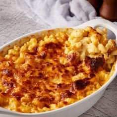 a casserole dish with macaroni and cheese in it on a table