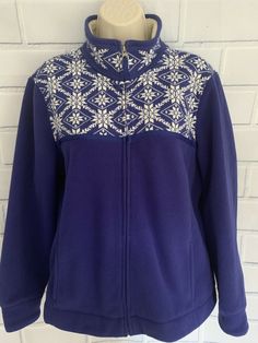 L.L. Bean Nordic Snowflake Fair Isle Fleece Jacket Women’s Size Large Royal Blue shade with Whitish Ivory snowflake print and Sherpa accents Lightweight Jacket Full zipper closure Faux Sherpa trim inside collar & cuffs Mock neck collar can be worn standing up or folded over The snowflake patterned front and back yoke is a sweater like knit and the rest of the body is fleece Pockets that zip  Sleeves can be folded up to show faux Sherpa fleece 100% Polyester Machine washable Condition:  This jack Navy Winter Outerwear, Cozy Navy Winter Outerwear, Navy Fleece Winter Outerwear, Navy Fleece Outerwear For Winter, Blue Nordic Long Sleeve Outerwear, Nordic Snowflake, Snowflake Print, Fair Isle Sweater, Sherpa Fleece