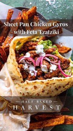 a chicken gyro with feta taziki and sweet potato fries