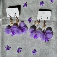 These earrings are inspired by the jacaranda tree, a symbol of the arrival of spring. I am a Japanese living on the Sapphire Coast, captivated by the natural beauty of Australia. Through my handmade creations, I aim to capture this beauty and bring smiles to those who wear them. ⚫︎ Please note that colors may appear different from the actual product due to lighting during photography. ⚫︎ Each piece is carefully crafted by hand, so please handle with care. **Returns and Exchanges** ⚫︎ If there is Handmade Purple Chandelier Earrings As Gift, Bohemian Dangle Earrings With Birth Flower, Purple Drop Chandelier Earrings As Gift, Purple Flower-shaped Whimsical Jewelry, Handmade Nature-inspired Earrings As A Gift For Her, Unique Flower-shaped Pierced Earrings, Elegant Lavender Flower Earrings For Gift, Whimsical Purple Flower Jewelry, Whimsical Purple Flower-shaped Jewelry