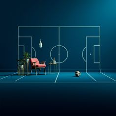 a blue room with a soccer field and chair