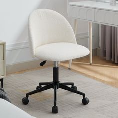 a white desk chair sitting on top of a rug