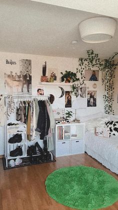 a bedroom with white walls and wooden floors