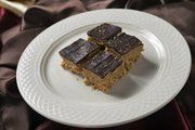 three pieces of cake on a white plate