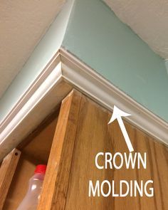 the crown molding has been placed on top of the cabinet and is ready to be painted