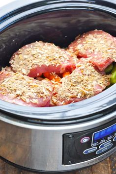 some meat and vegetables are in the slow cooker