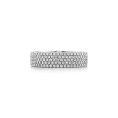 Streamlined and modern, the Tiffany Metro collection twinkles like a nighttime city skyline. Five rows of dazzling diamonds make this ring a stunning statement piece. 18k white gold with round brilliant diamonds; Carat total weight .94; Our 18k white gold is plated with rhodium to maintain its brilliance | Tiffany Metro Five-Row Ring in 18k White Gold with Diamonds, Size: 7 Tiffany Stackable Rings, Nighttime City, Tiffany Diamond Ring, Tiffany Ring, Tiffany Rings, Forever Rings, Vintage Tiffany, Christmas Wishlist, City Skyline