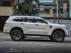 a white truck parked in front of a building