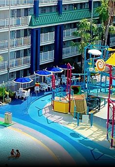 an aerial view of a children's play area in front of a large building