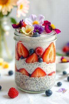 a jar filled with fruit and oatmeal on top of a white table