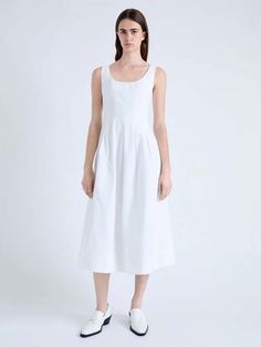 The shelby dress in cotton linen is crafted to a paneled fit and flare silhouette with a soft square neckline. completed with hidden front slip pockets and seam line detailing around the dress.    details    - white  - square neckline  - sleeveless  - paneled construction  - seam line details  - hidden front slip pockets  - straight hem  - fit and flare silhouette  - center back invisible zipper  - hook and eye closure  - 100% cotton  - proenza schouler white label (pswl)  - sku: wl2433416sc088100    size + fit    - model is 5'10'' with 31'' bust / 34.5'' hips. wearing size 4    care    - 100% cotton  - dry clean only White Cotton Linen Dress With Square Neck, Chic White A-line Linen Dress, White Cotton Dress With Pleated Bodice, Classic White Linen Midi Dress, Unlined A-line Linen Dress For Daywear, Unlined A-line Midi Dress For Daywear, Classic White Cotton Midi Dress, White Sleeveless Dress With French Seams, Linen A-line Dress With Fitted Bodice