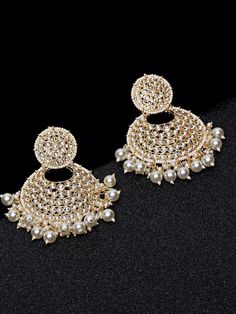 These exquisite gold-toned 2-layer crescent chandbali earrings come with kundan stone studs & beads, are gold-plated, and are secured with a post and back closure. These handcrafted chandbalis can be styled with any ethnic outfit for a dramatic impact, or an evening outfit to complete a dazzling look. Eitherway, complements are all yours! Product color may vary based on the monitor or screen you are using.See FAQ for more details. Size Length: 8.5 cm Details Material: BrassStones: Kundan & Artif Elegant Metal Chandbali Earrings, Festive Kundan Chandbalis With Pearl Drop, Gold Metal Chandbalis With Intricate Design, Gold Chandbalis With Intricate Metal Design, Gold Chandbalis With Intricate Design, Bollywood Style Gold Bridal Earrings, Bollywood Chandbali Earrings With Pearl Drop, Eid Pearl Drop Chandbali Jewelry, Eid Chandbali Pearl Drop Earrings