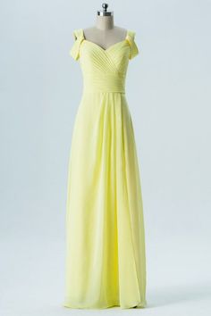 a yellow bridesmaid dress on a mannequin