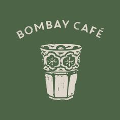 a green t - shirt with the words bombay cafe on it