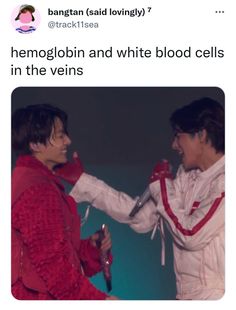 two people in red and white outfits are touching each other's hands with scissors