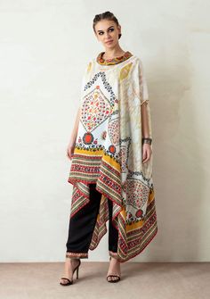 Editor's Note Cowl Neck Tunic With Drop Sleeve & Plain Palazzo With Front Belt Back Elastic Color: Ivory Fabric: Silk And Satin Care: Dry Clean Only About the Designer Rajdeep Ranawat, Indian artisan skills, and techniques are utilized to produce fine embroidered, sequinned, beaded motifs and designs. Further, original digital and block prints in generic western Silhouettes create a novel blend. Using the finest materials, weaves, metallic threads, beads, pearls, sequins and SWAROVSKI elements a Satin Kurta, Rajdeep Ranawat, Cape For Women, Tunics Online, Cowl Neck Tunic, White Tunic, Silk Tunic, Embroidered Neckline, Saree Dress