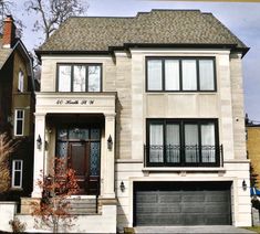 a two story house with an attached garage