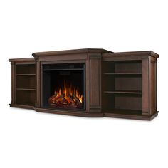 an entertainment center with a fire place and bookcases on the sides, in dark wood