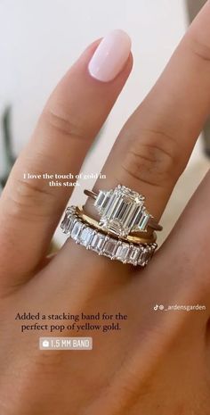 a woman's hand with two rings on it and the words, add a stacking band for the perfect setting to show gold