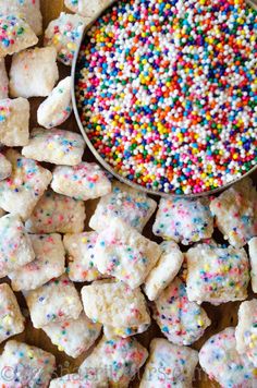 sprinkles and sugar cubes next to a spoon