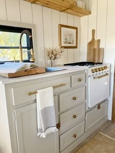 a kitchen with an oven, sink and counter top in it's center island