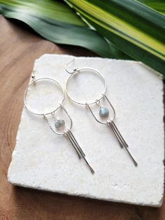 The Solstice Earrings in Moonstone have been a top seller that I decided to design them with Labradorite as well! These beauties are light weight and you can wear them as an everyday earring or take them out on a special night. They are very versatile. Each piece is handmade with your choice of 14K Gold Filled or Sterling Silver. The length of the earrings are just over 3 in. Labradorite is a natural stone and the color may slightly vary. You can see the colors in the 4th picture. Thank you for Everyday Earrings, Top Seller, I Decided, Sterling Silver Earrings, Moonstone, Labradorite, Natural Stones, Gold Filled, Sterling Silver