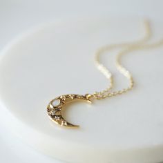 "Beautiful and lovely dainty moon necklace. Made of opal stone and CZ stone gold color moon pendant with skinny gold plated brass chain. Soft and simple. Great for gift, everyday or special occasion. Your item will ship in a gift box. Please feel free to contact me if you have any questions. ♥ Chain length 14\" - 20\" ♥ Moon pendant 5/8\" x 3/4\" ♥ Gold plated over brass / Opal stone ♥ Creation Time: 1 - 3 days ♥ See more Rudiana Accessories Rudiana.etsy.com" Dainty Moon Necklace, Moon Necklace Gold, Golden Moon, Star And Moon Necklace, Gold Moon Necklace, Necklace Opal, Collar Chain, Celestial Necklace, Moon Pendant Necklace