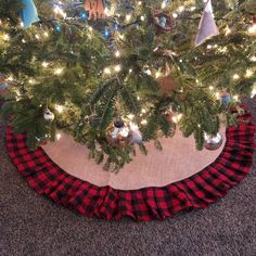 a christmas tree skirt is on the floor