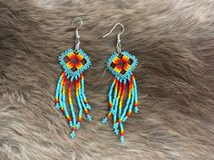 Authentic Beautiful Native American Indian Jewelry Navajo Hand Beaded Long Dangle Earrings. Great for a gift❤️ Handcrafted by Navajo Artist R. Sellers These beautiful earrings are 5.5" in length and 1" in width. Southwestern Style Round Bead Earrings For Festivals, Southwestern Style Earrings With Round Beads For Festivals, Southwestern Style Beaded Drop Earrings, Southwestern Beaded Drop Earrings For Pierced Ears, Southwestern Style Drop Earrings, Adjustable Southwestern Beaded Earrings, Southwestern Style Beaded Earrings For Festival, Southwestern Multicolor Beaded Earrings, Southwestern Teardrop Beaded Earrings