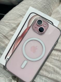 an iphone case with a magnifying glass on the front and back cover in pink