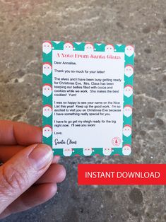 a hand holding up a business card with santas on it and the text instant santa's guide