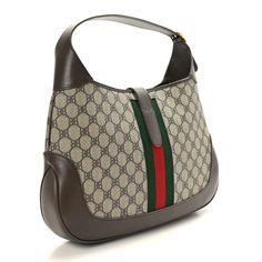 This is an authentic GUCCI X BALENCIAGA BB Supreme Monogram Calfskin Web Medium Jackie 1961 in Hobo Beige and New Acero. This Gucci hobo is beautifully crafted of traditional brown on beige coated canvas with the Balenciaga BB monogram. The bag features a signature red and green web stripe down the center and brown textured calfskin leather trim including the adjustable looping shoulder strap, base, corners, and crossover strap. The crossover strap is secured with an aged, gold-tone piston lock and opens to a brown fabric interior with a patch pocket. This chic bag is part of The Hacker Project collaboration between Balenciaga and Gucci! Gucci X Balenciaga, Bb Monogram, The Hacker, Green Web, Gucci Crossbody Bag, Gucci Crossbody, Brown Texture, Gucci Shoulder Bag, Chic Bags