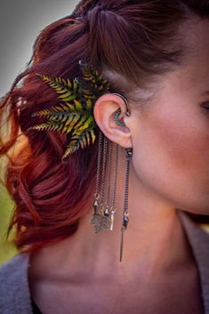 "Introducing our handmade leather fern ear cuff wrap with a stunning 3D realistic design. Each cuff is meticulously hand-tooled and painted with leather ferns, which are individually hand-dyed using special techniques, waxed, and shaped by hand to create a nature-inspired statement piece that is perfect for adding a touch of boho style to any outfit. This ear cuff is perfect for everyday wear, fairs, festivals, renaissance faires, and costumes, making it a must-have accessory for anyone who love Cottagecore Style, Aging Beautifully, Fantasy Clothing, Leather Keychain, Festival Wear, Belly Dance, Handmade Leather, Nature Inspired, Fern