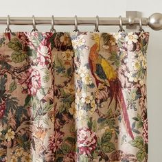 a curtain with a bird and flowers on it