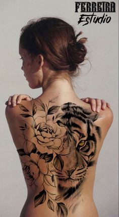 a woman with a tiger tattoo on her back