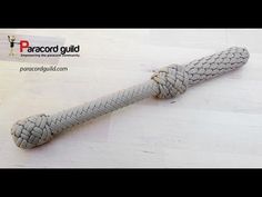 an image of a rope that is on the floor in front of a white background