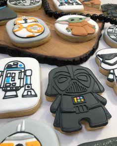 star wars decorated cookies are displayed on a table