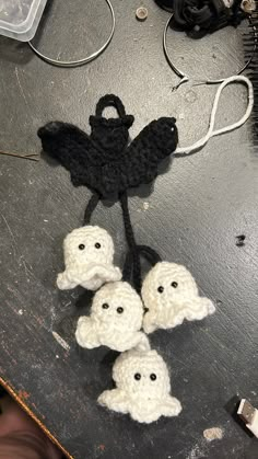 crocheted black and white decorations on a table