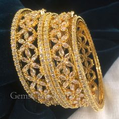 BEAUTIFUL CUBIC ZIRCON BANGLE *  Main Color : Gold * Skin Friendly : This Product does not contain harmful constituents. Anti-allergic safe for Skin. * Quality : Made from Premium Quality Material. This Product assures to remain in its Original Glory even after several usages.     . Actual Images of item are shown above, Please be aware of the actual colors may vary from the color shown on your screen, as monitor    settings may vary from individual to individual. . Welcome to Our Etsy Store! We Gold Cubic Zirconia Round Bridal Sets, Gold Plated Round Bangle For Wedding, Hand Set Gold Plated Bangle For Wedding, Intricate Design Wedding Bangle, Hand Set Gold Plated Bracelets For Weddings, White Gold Plated Bracelets For Wedding, Gold Cubic Zirconia Wedding Bracelets, Cubic Zirconia Bangle For Wedding, White Gold Plated Bracelet For Wedding