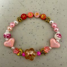 Beautiful Bracelet Made With Pink Hearts And Flowers With Gold Accents Hope Bracelet, Hearts And Flowers, Pink Hearts, Beautiful Bracelet, Pink Heart, Womens Jewelry Bracelets, Gold Accents, Bracelet Making, Pink And Gold