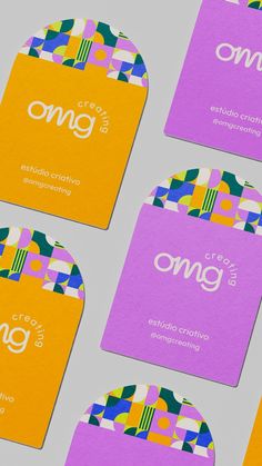 four business cards with different colors and designs on the front, one for omo