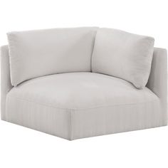 the corner chair is white and has two pillows on it, while the rest of the couch