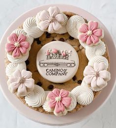 a cake decorated with pink and white flowers