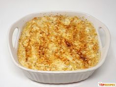 a casserole dish with cheese and seasoning in it