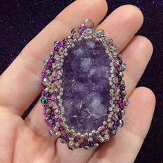 "This gorgeous chunky amethyst druzy stone is bead embroidered with a variety of sparkly beads that are sure to catch the eye. It is backed with a purple foil leather. This pendant measures approximately 1 1/2\" wide by 2 1/2\" long (including jump ring). It is 1/2\" thick." Beaded Amethyst Pendant Jewelry, Amethyst Beaded Pendant Jewelry, Purple Spiritual Crystals For Jewelry Making, Bohemian Purple Amethyst Crystals, Unique Purple Natural Stone Geodes, Unique Purple Geodes With Natural Stones, Purple Geodes With Natural Stones, Unique Amethyst Beaded Jewelry, Purple Bohemian Crystals With Natural Stones