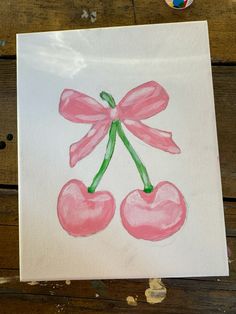 a piece of paper that has been drawn with watercolors on it and some cherries