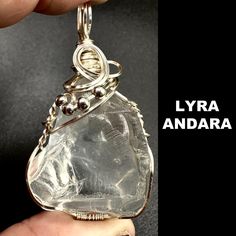 ANDARA CRYSTAL NECKLACE. Handmade by our master crystal healer and encoded to Lyra for all starseeds. Made with Silver wire and complimentary 18 inch silver plated necklace. This is authentic Andara from Mt Shasta that comes with a certificate and money back guarantee. We are the original creators of this energy on earth and invite all starseeds to find comfort in its embrace and to bring forth your own home energy to help you on your spiritual journey on Earth. If you are a Lyrian Soul, you are Handmade Healing Crystals, Handmade Silver Crystal, Handmade Spiritual Crystal Necklaces, Wire Wrapped Crystal Necklaces For Healing, Clear Crystal Spiritual Necklaces, Silver Wire Wrapped Crystals For Jewelry Making, Handmade Silver Crystals For Jewelry Making, Spiritual Style Clear Wire Wrapped Jewelry, Spiritual Clear Crystal Necklace