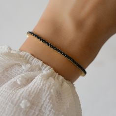 Dainty and minimalist black tennis bracelet is a stunning accessory! Looks great stacked or on its own!  - - - D E T A I L S - - - * Made of 925 Sterling Silver * We use a THICK plating of 14k Gold or Rhodium  * Available in 6.25" or 6.75" Lengths * Latch closure for a super high end look! * 2mm Width  * Nickel-free & Hypoallergenic  Made with 100% Pure Love! ��♡ Happy to answer any questions you may have! 🥰 Bracelet Tennis, Bracelet Minimalist, Bracelet Dainty, Dainty Bracelet, Minimalist Bracelet, Dainty Bracelets, Bracelet Black, Black Jewelry, Tennis Bracelet