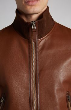 A hybrid of track and bomber styles, this leather jacket features rib trim at the cuffs, hem and stand collar and the brand's signature grab handle at the nape. 25" length (size 50EU) Two-way front-zip closure Stand collar Front zip pockets Ribbed cuffs and hem Lined Leather Professional leather clean Made in Italy Designer Clothing Tom Ford Leather Jacket, Tom Ford Man, Leather Fashion Men, Tom Ford Leather, Tom Ford Men, Tan Jacket, Futuristic Fashion, Pants Casual, Leather Cleaning